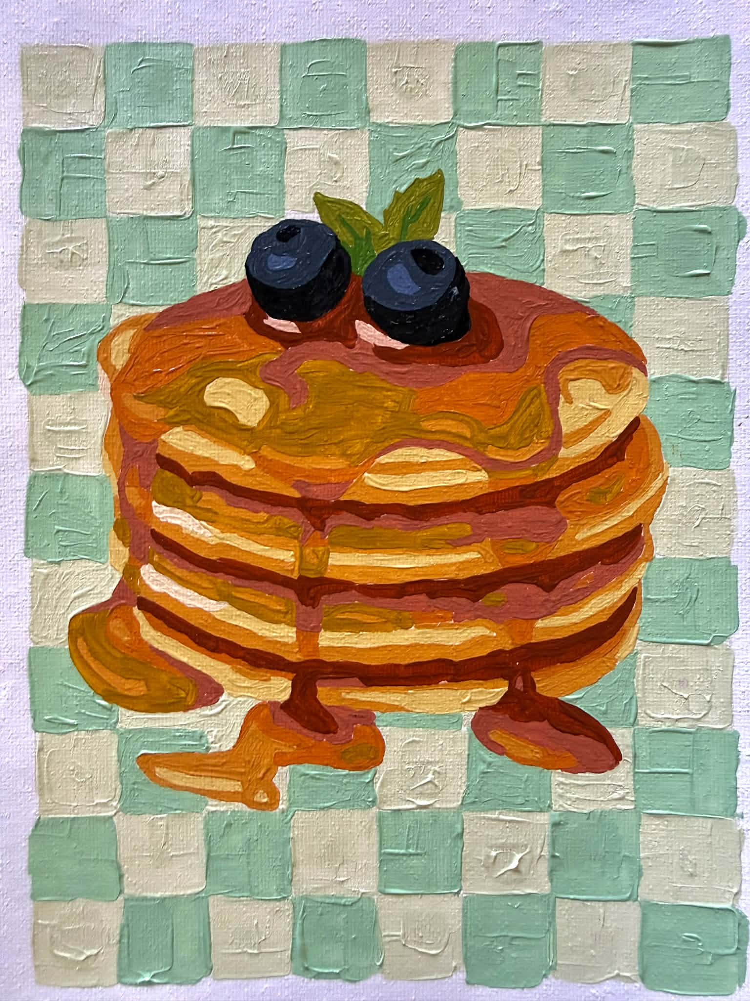 Painting of a stack of pancakes with blueberries on green checkered background
